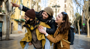 Three students enjoying a walk outside.