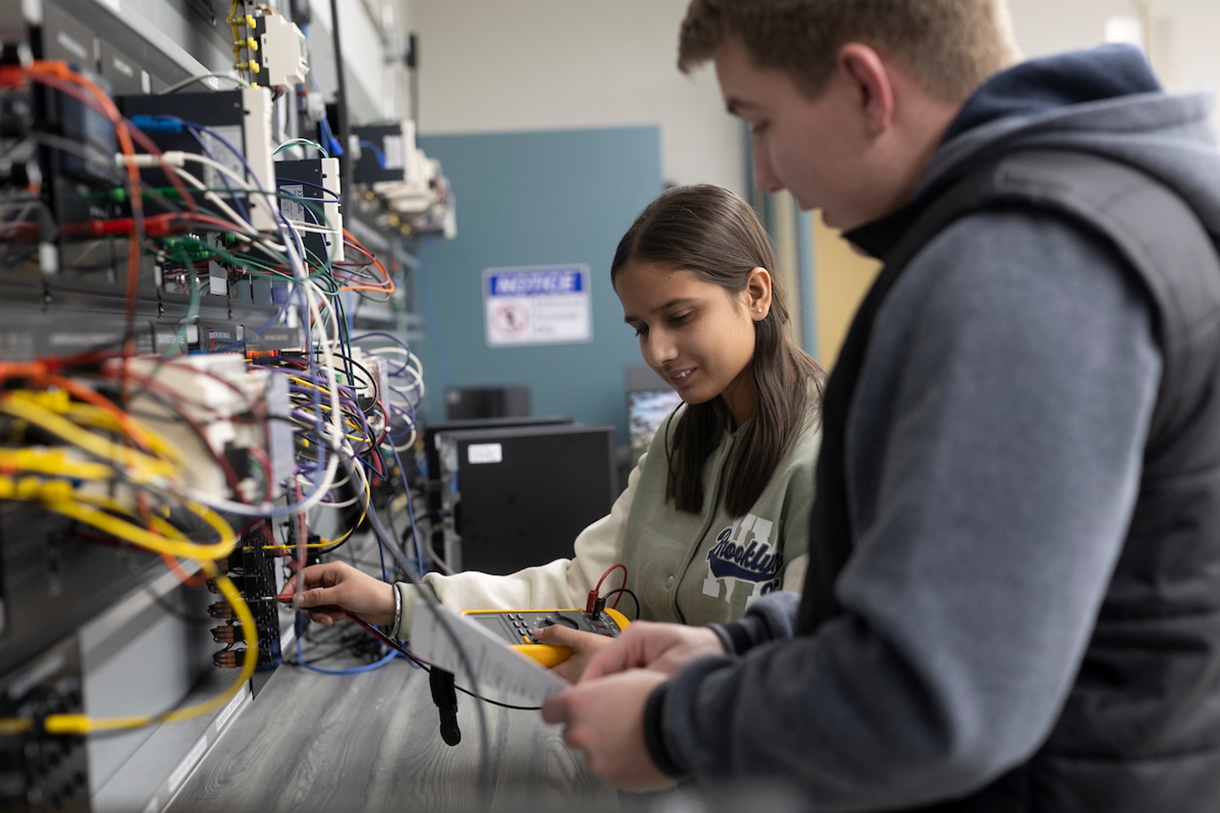 technology students work on an energy learning system 