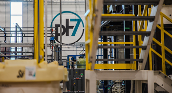 pH7 logo on the back wall of a factory